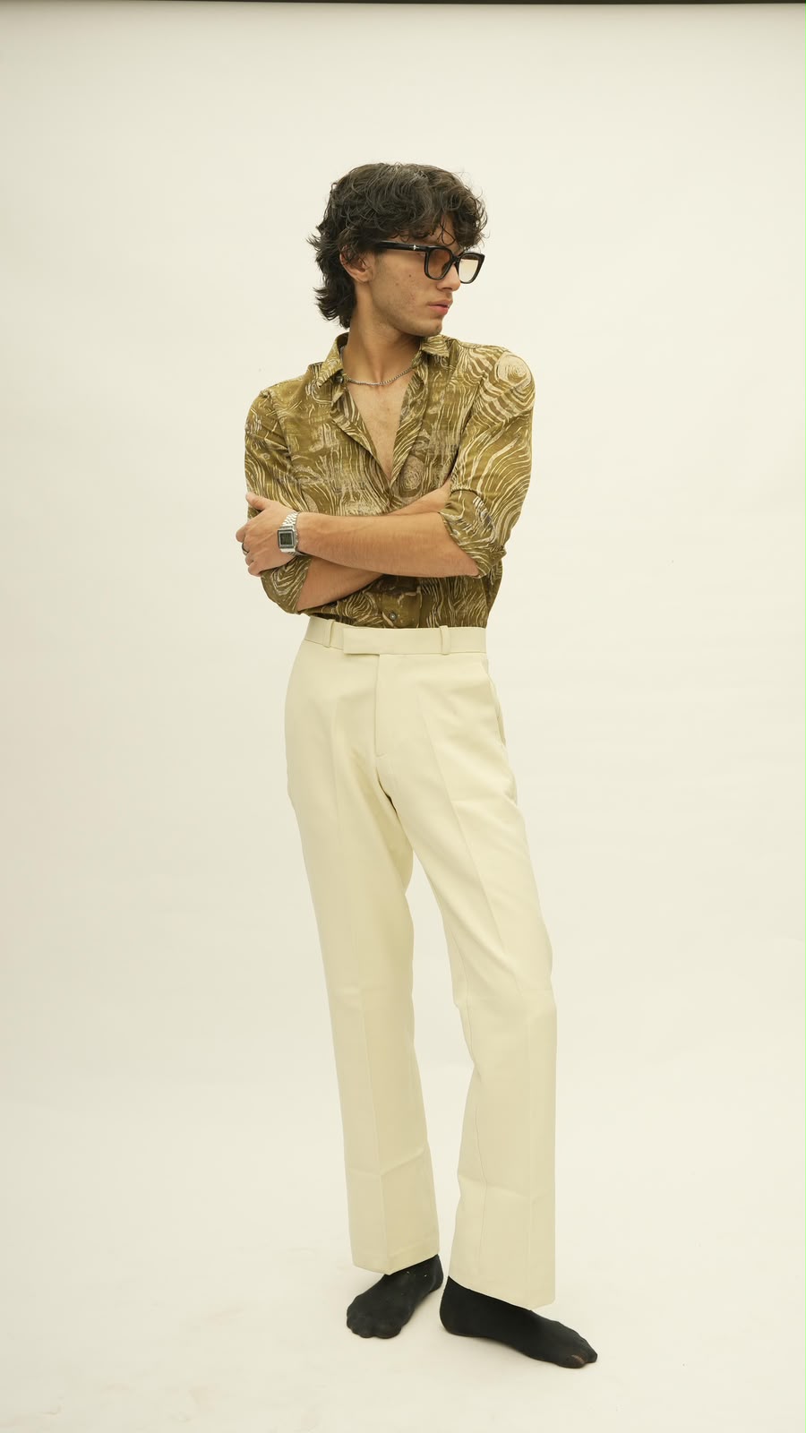 Printed shirt with cream trousers