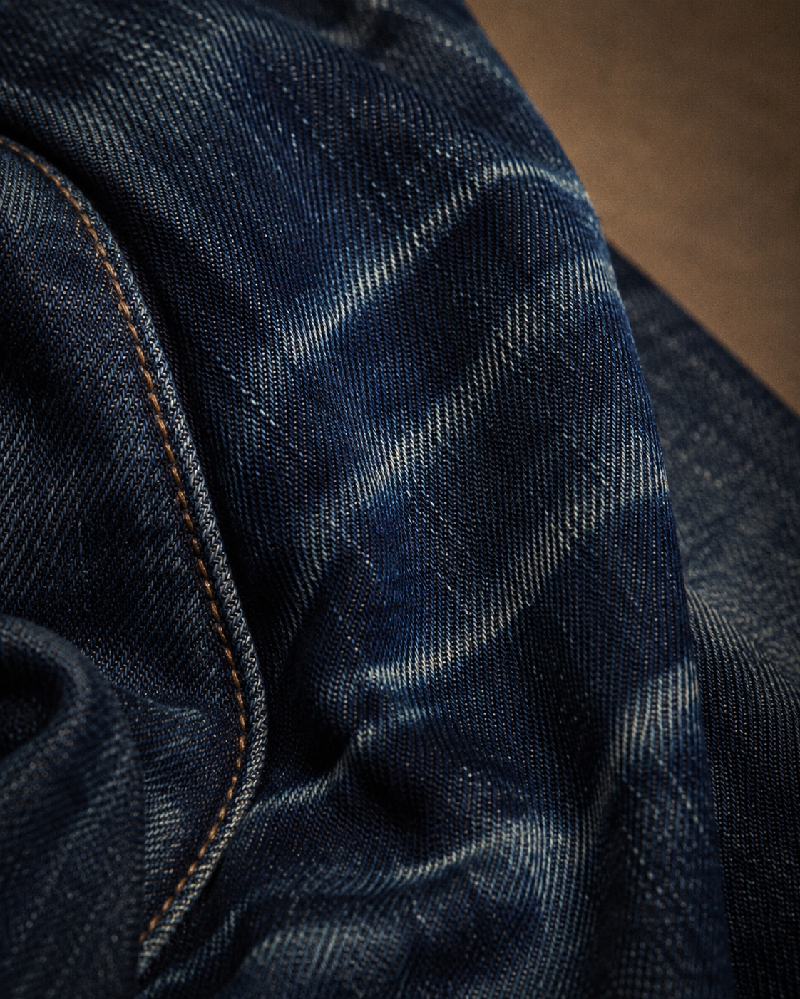 Macro detail of indigo denim twill and fades